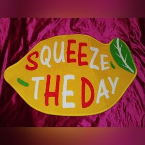 Lemon Shaped Bath Mat with "Squeeze the Day" Text